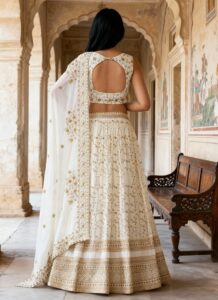 White faux georgette A-line lehenga with zari sequins work back view