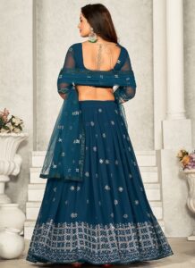 Blue umbrella lehenga with silver embroidery and sequins back view