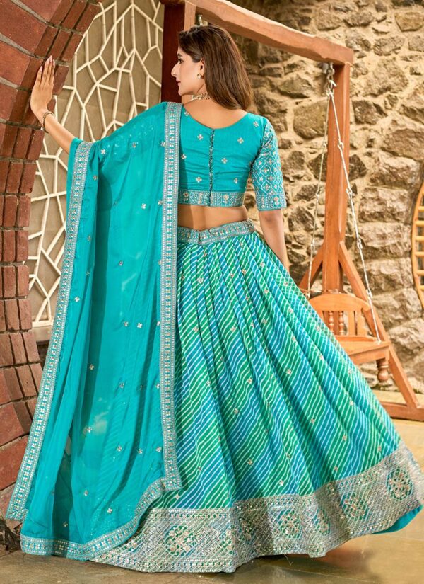 Sky blue umbrella lehenga choli with embroidered border festive wear back view