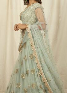 Mint green net lehenga with sequins embroidery wedding wear side view