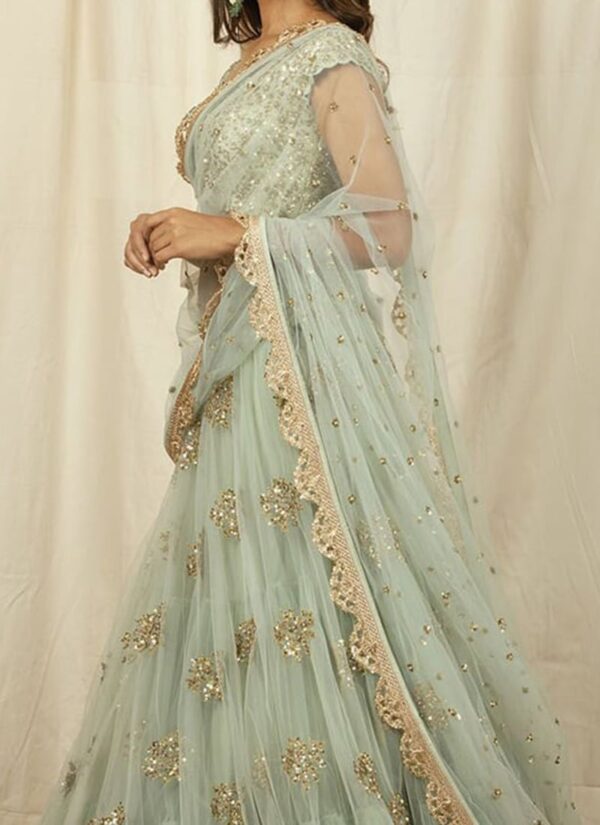 Mint green net lehenga with sequins embroidery wedding wear side view